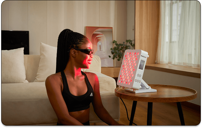 A woman receiving red light therapy for eye protection