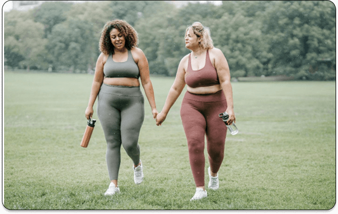 two-athletic-women-walking-in-the-park-feature-image